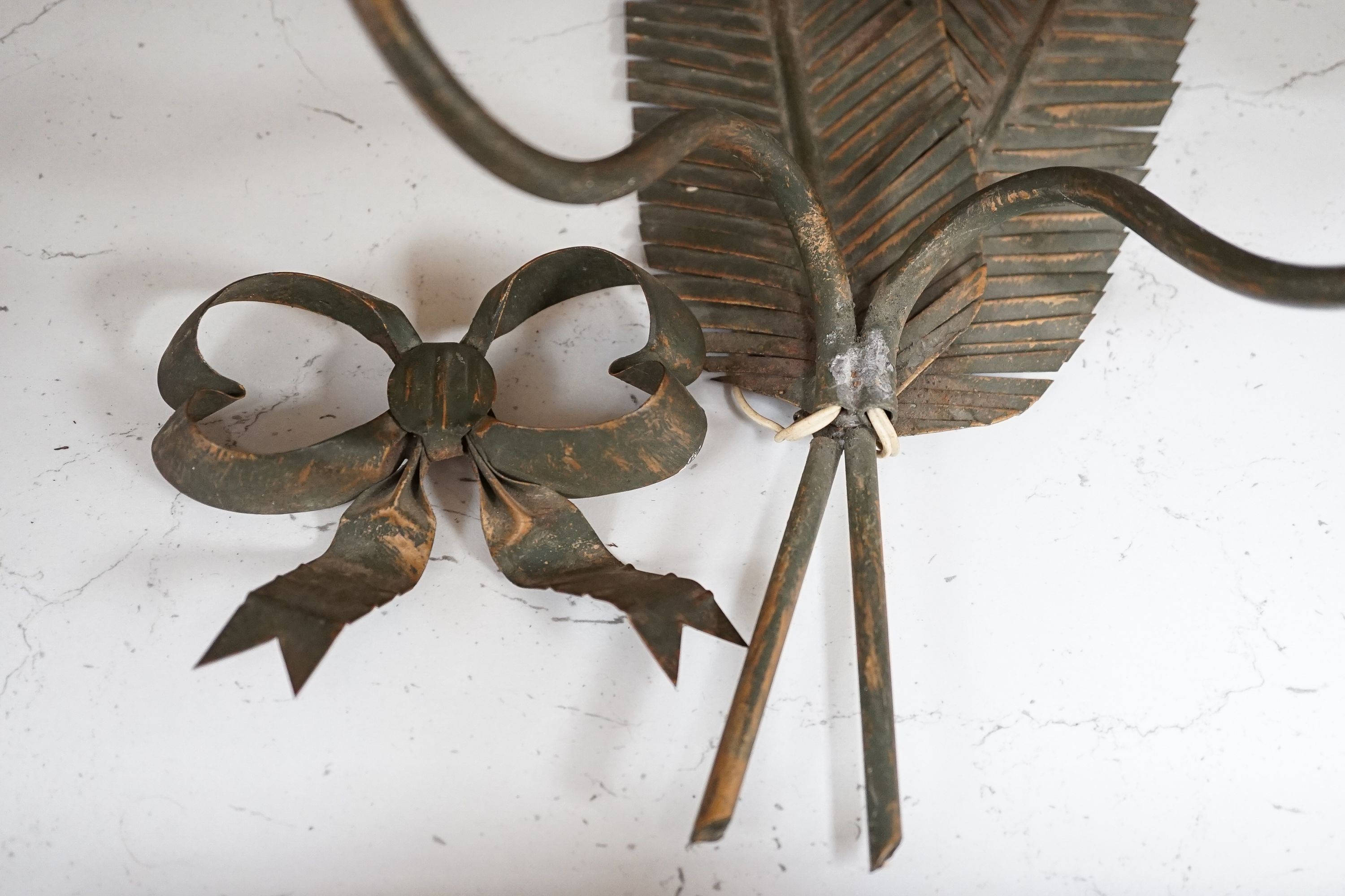 A pair of two branch ‘feather quill’ wall sconces, height 35cm